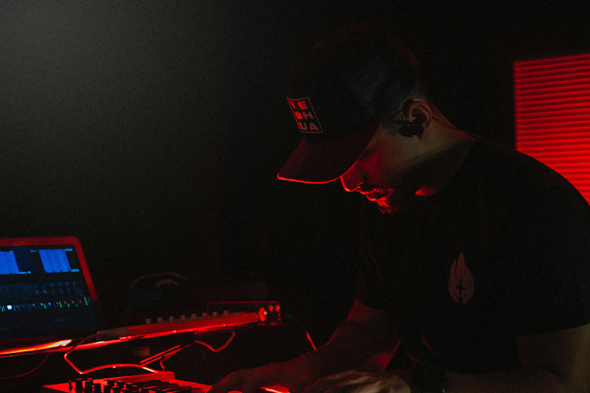 Man looking down in a music studio