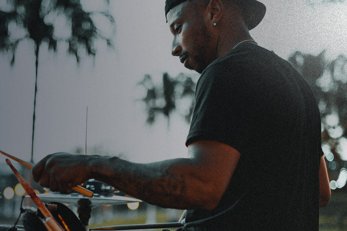 Man playing the drums outside