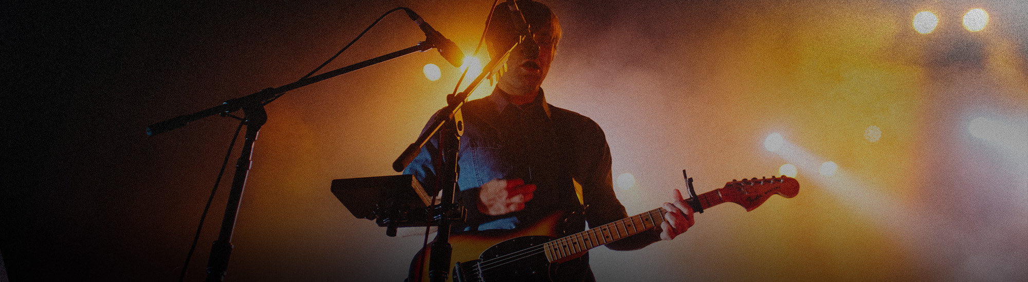 Man playing guitar on stage