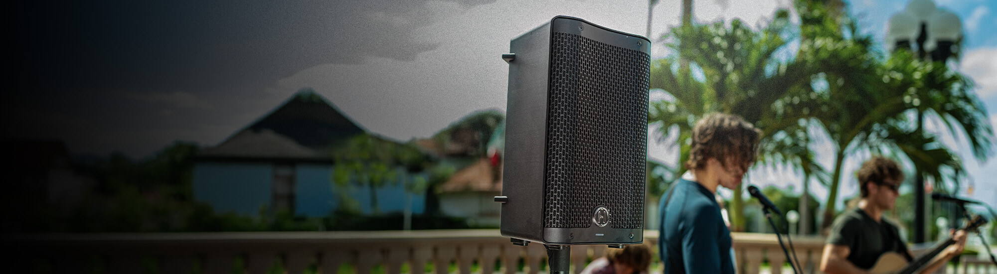 One Harbinger Vari Live V2400 Speaker on a pole at an outdoor concert