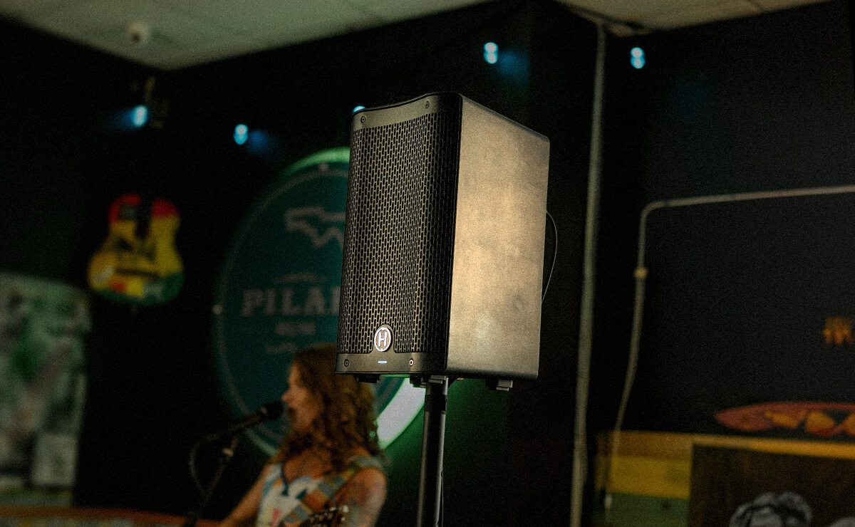 Harbinger Vari Live V2400 Speaker in a small venue with a female guitarist